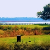 A fall view with bridge in background at Sanctuary Golf Club