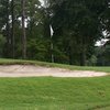 A view of green with bunker in foreground at Summerville Country Club