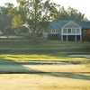 A view from hole #11 with clubhouse in background at Smithfields Country Club